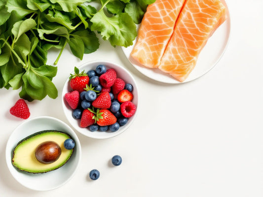 Fresh salmon, berries, avocado, and leafy greens – top foods for healthy glowing skin